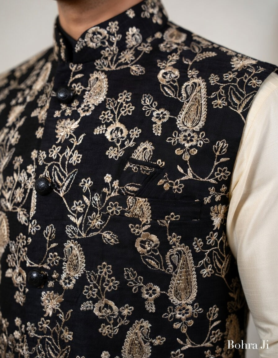 Black embroidered vest with intricate patterns on a neutral background