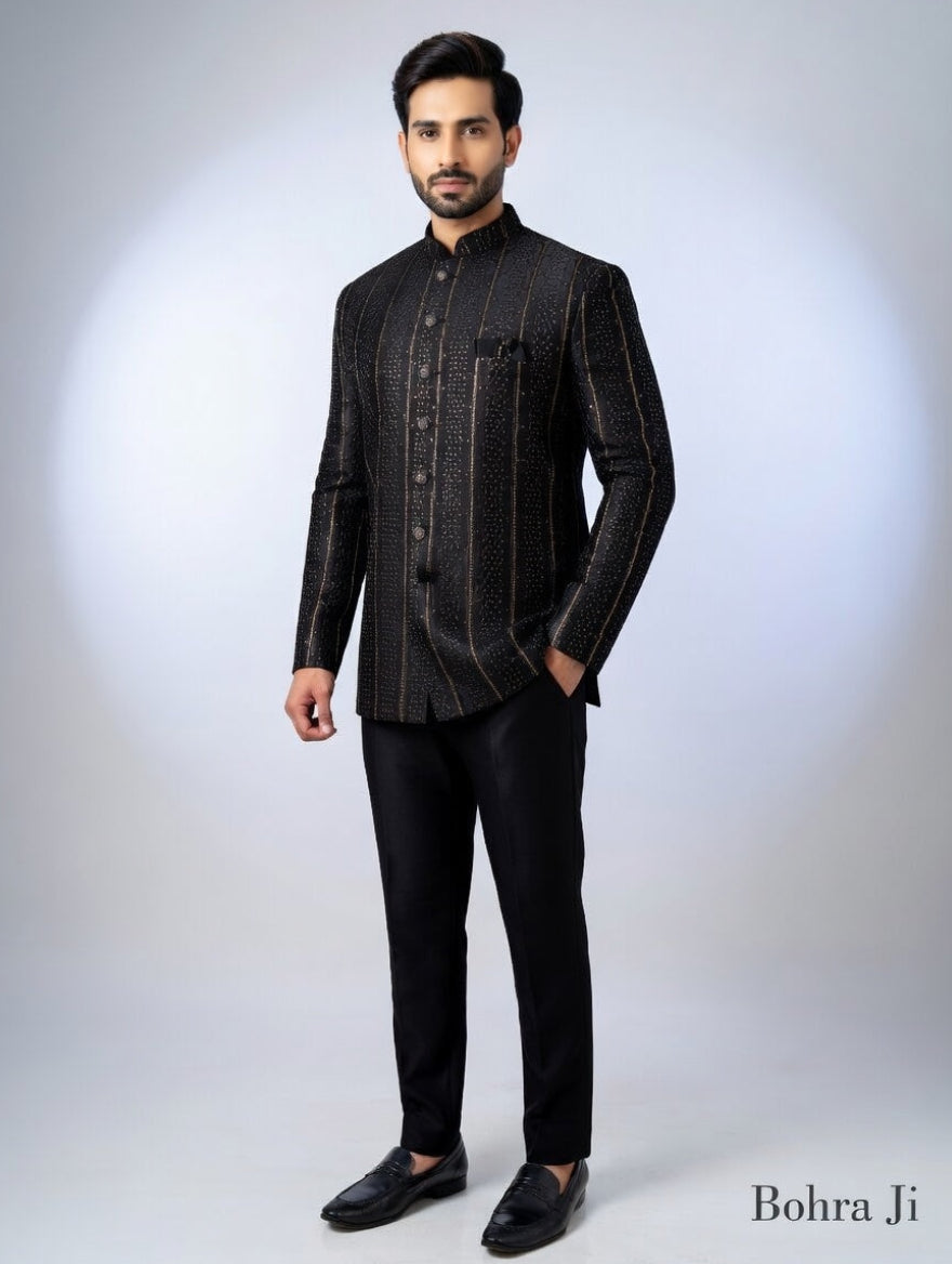 Man wearing a black traditional outfit with a white background