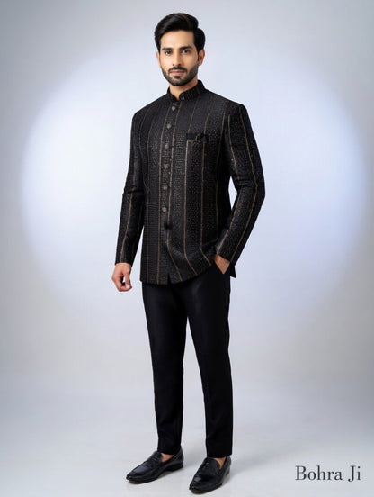 Man wearing a black traditional outfit with a white background