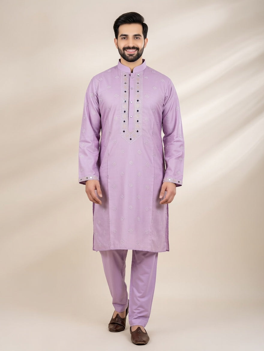 Man wearing a light purple kurta with pants on a beige background