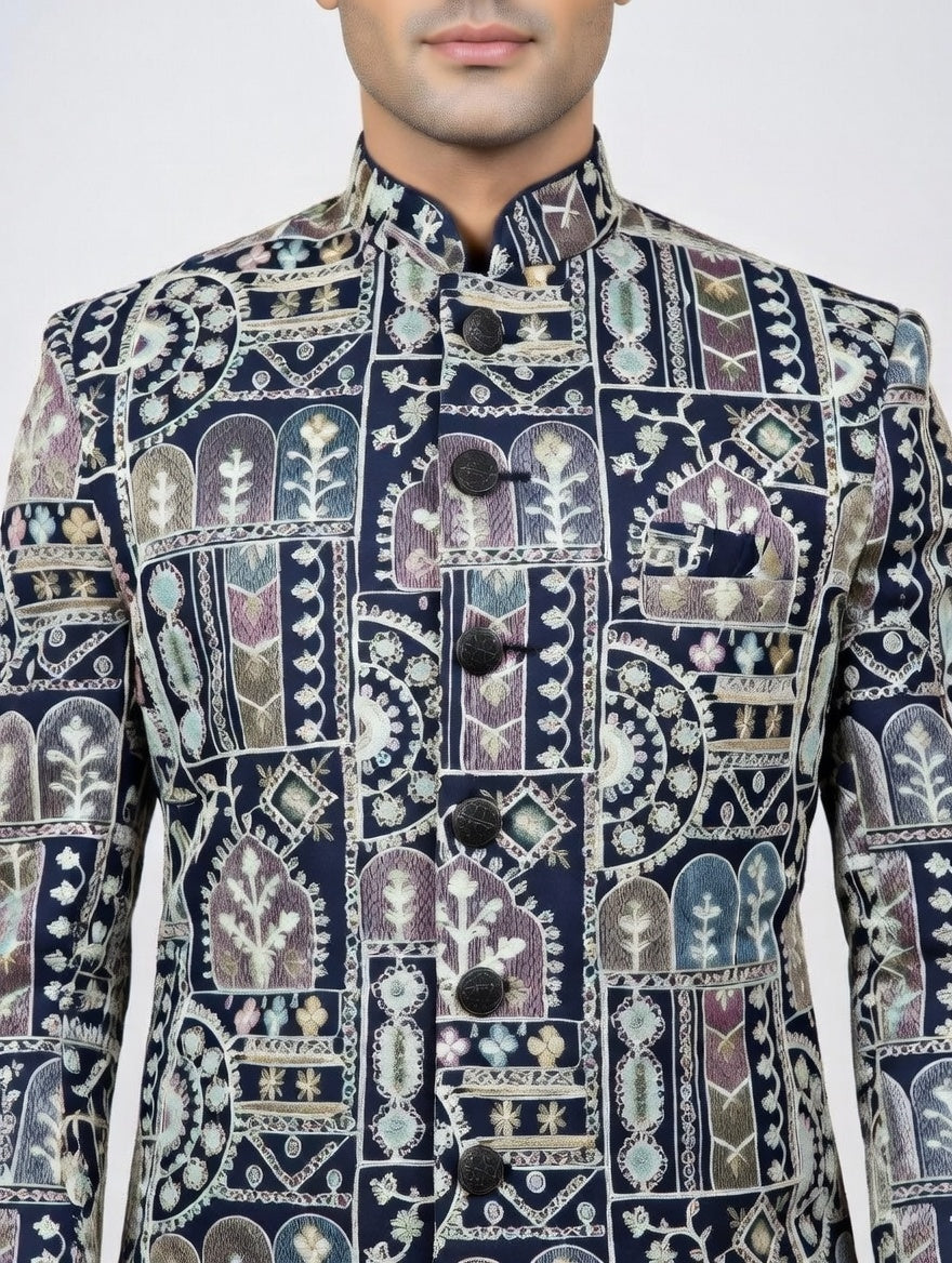 Navy blue embroidered jacket with intricate patterns on a white background