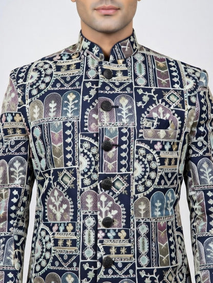 Navy blue embroidered jacket with intricate patterns on a white background