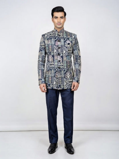 Man wearing a patterned jacket and dark pants on a white background