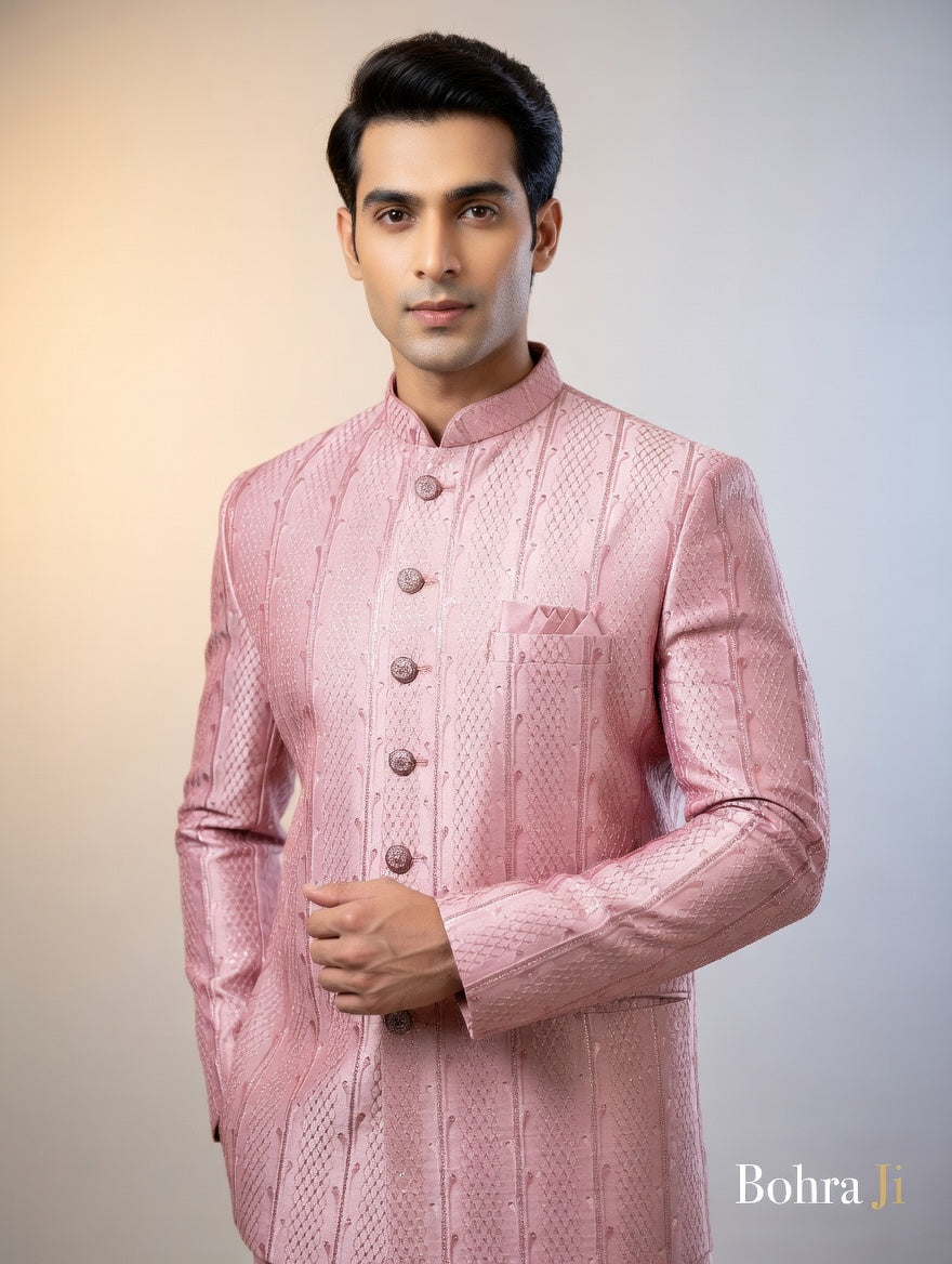 Man wearing a pink traditional sherwani with a blurred background