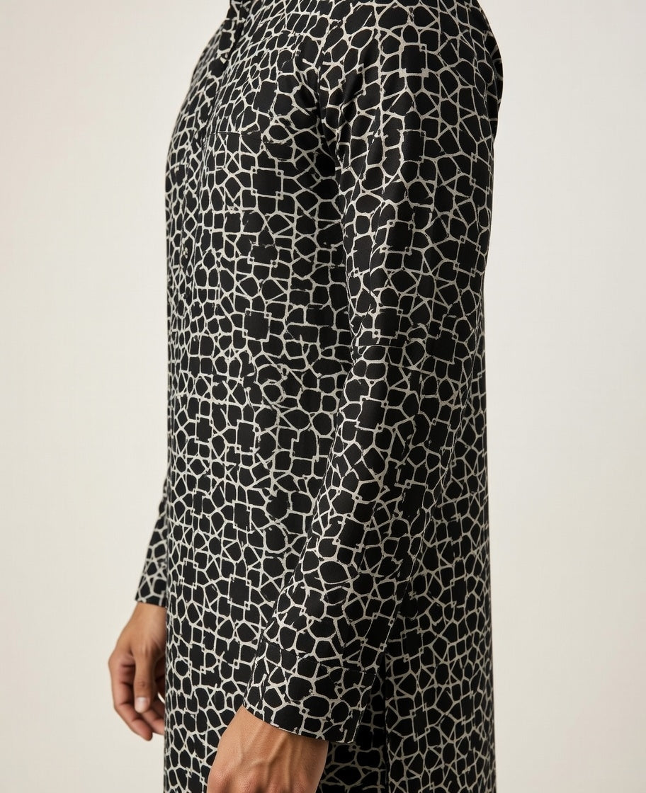 Black and white patterned dress on a plain background