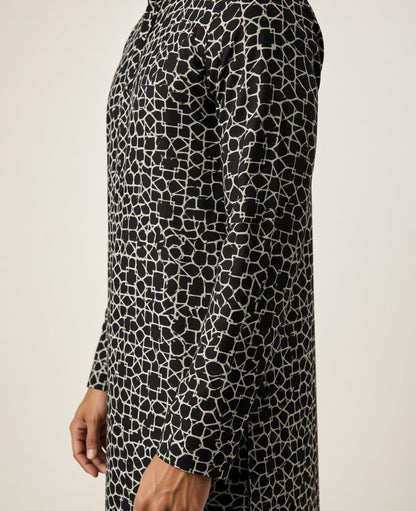 Black and white patterned dress on a plain background