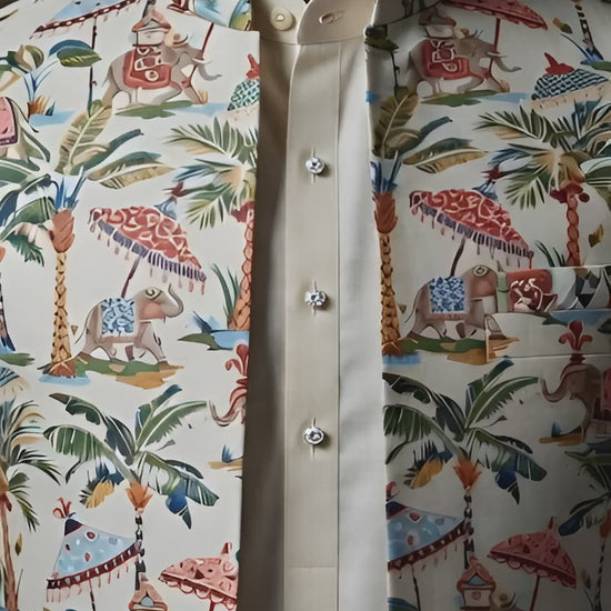 Men's ivory open Indo-Western jacket featuring a royal elephant and tropical palm tree print, layered over a matching inner kurta and trousers by Bohra Ji.