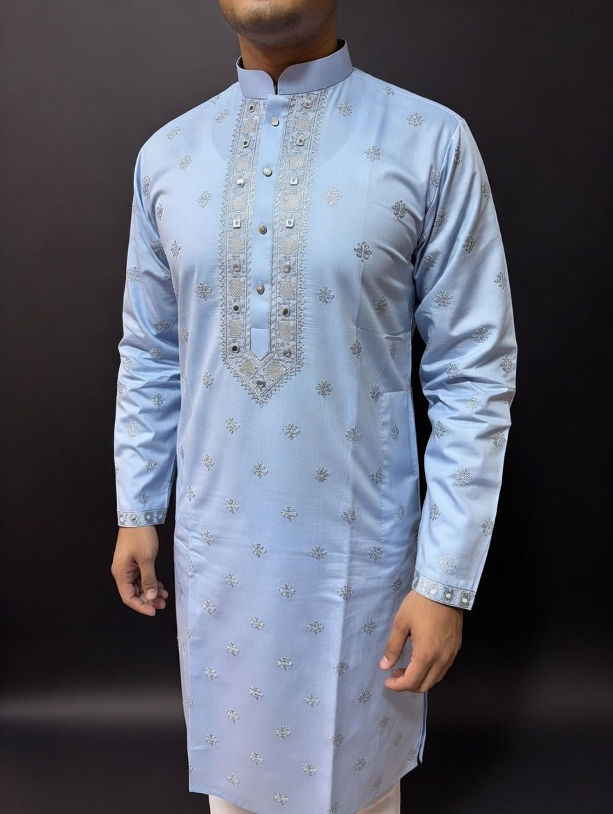 Light blue kurta with silver embroidery on a dark background