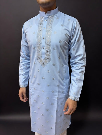 Light blue kurta with silver embroidery on a dark background